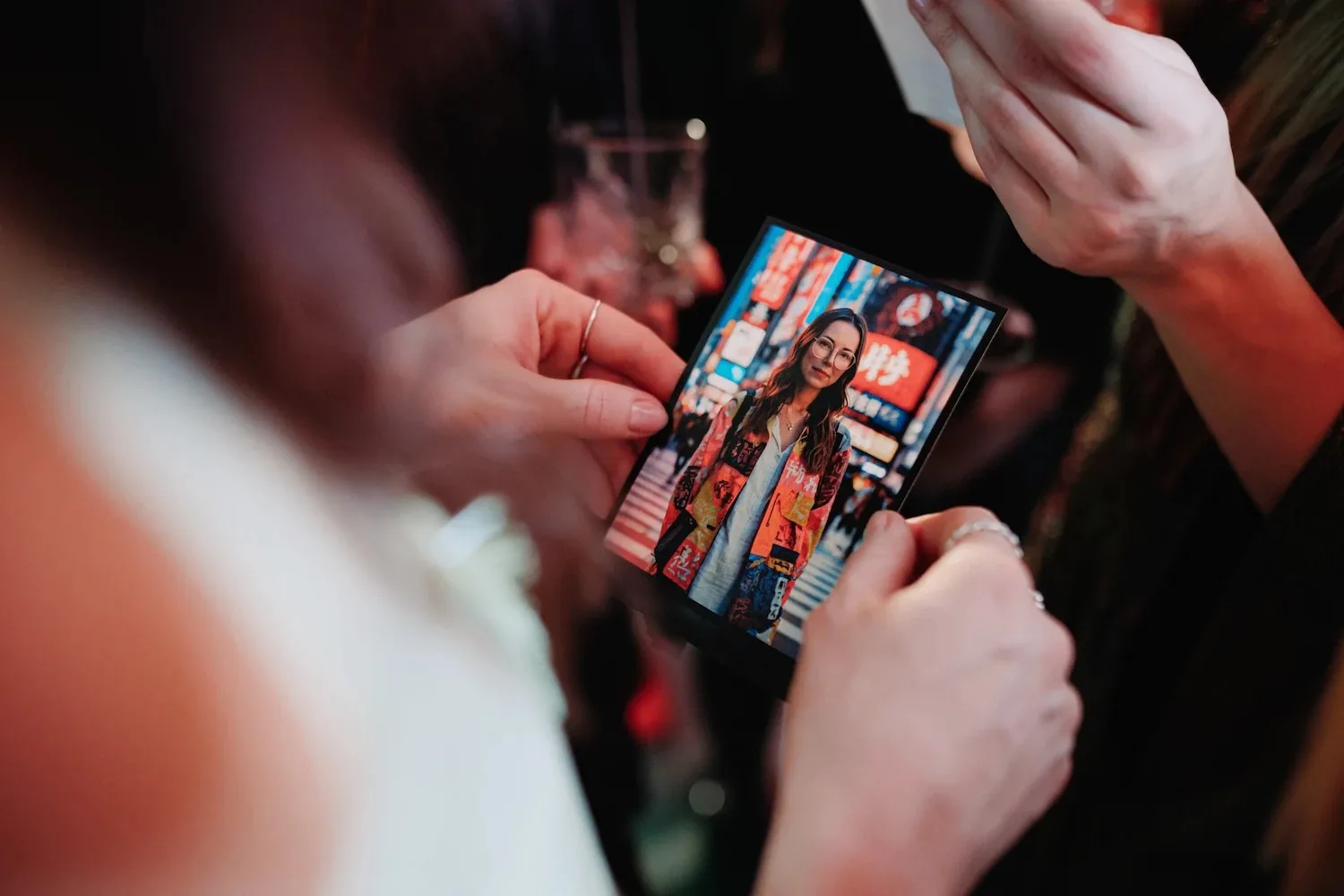 AI photo booth Switzerland – guests holding an instant photo print at a corporate event